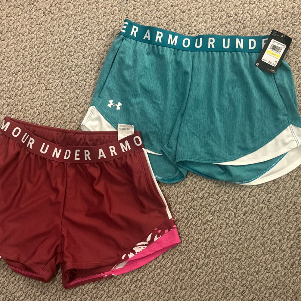 Two under armor athletic shorts new barely worn 

Blue + Maroon -  Womens M/S